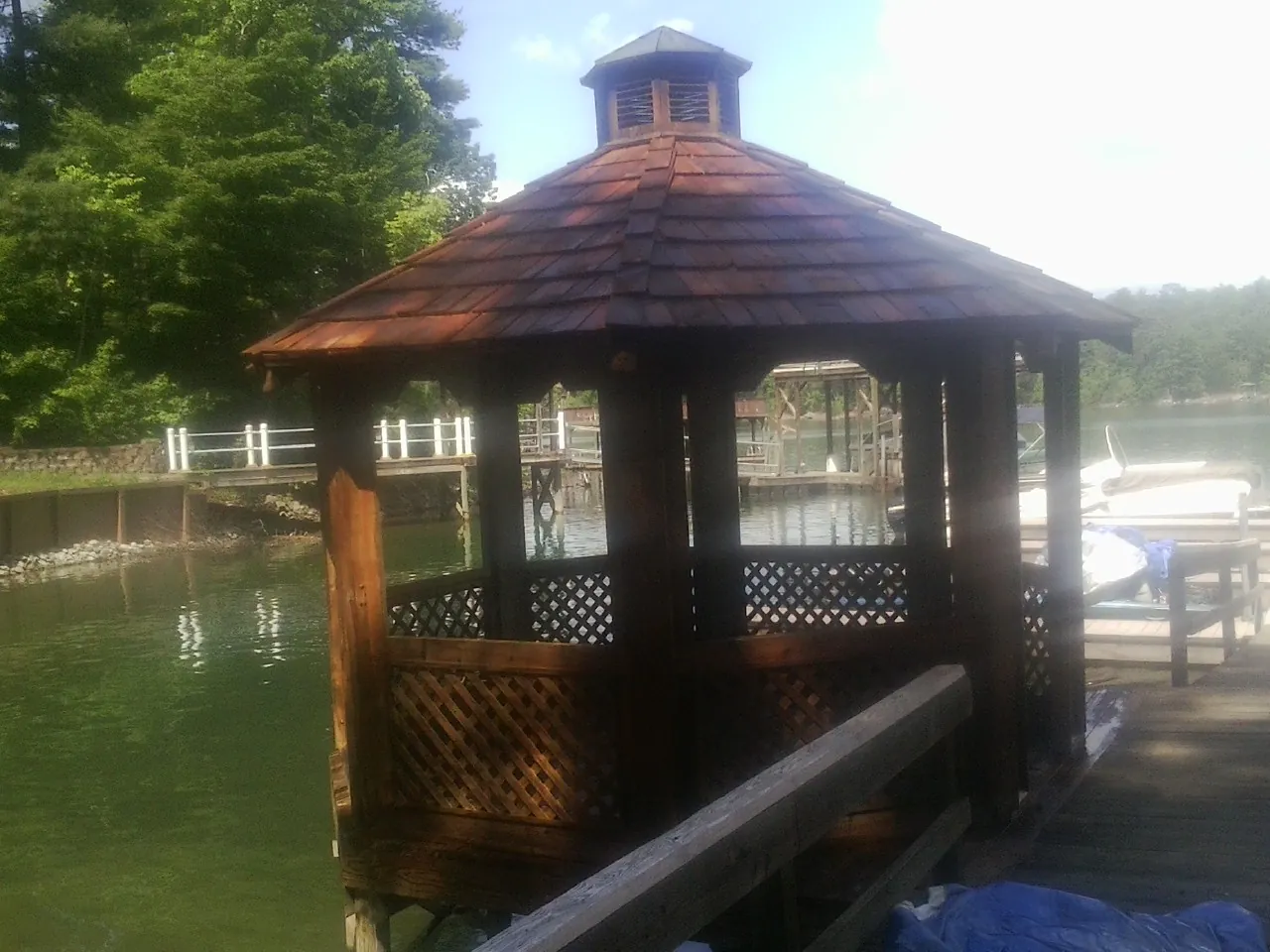 Cedar shake gazebo roof rebuilt on a lake dock in Branchville
